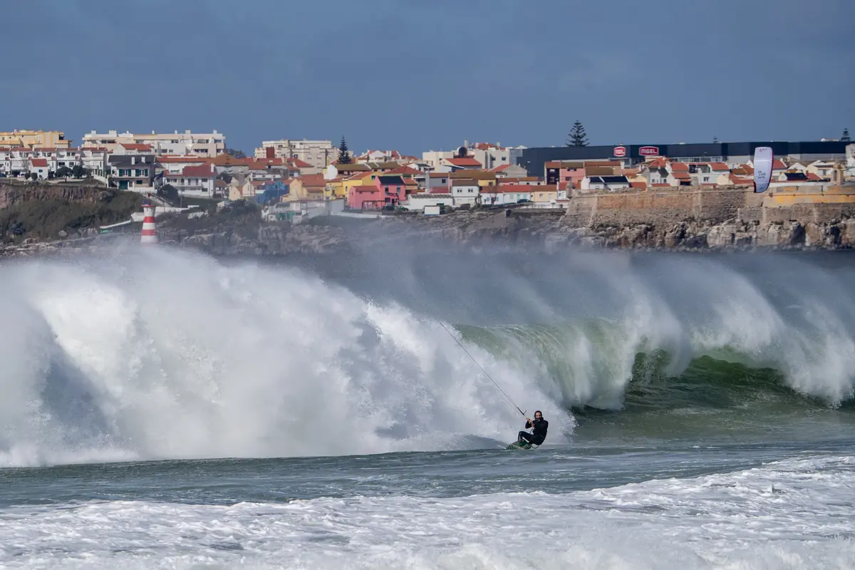 Federico riding a big wave in Nazaré